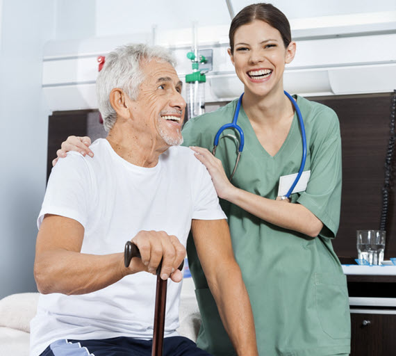 man with cane and aide